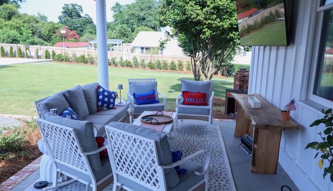 Covered patio seating by the lawn